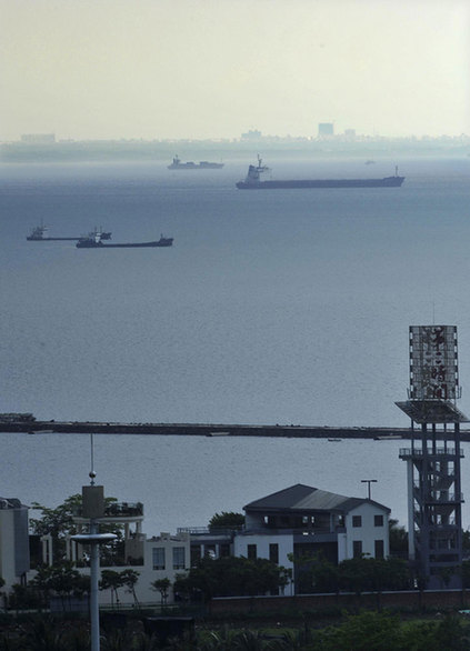 A mirage is seen above the sea water north of Haikou, capital of South China’s Hainan province, May 9, 2011. Just an illusion